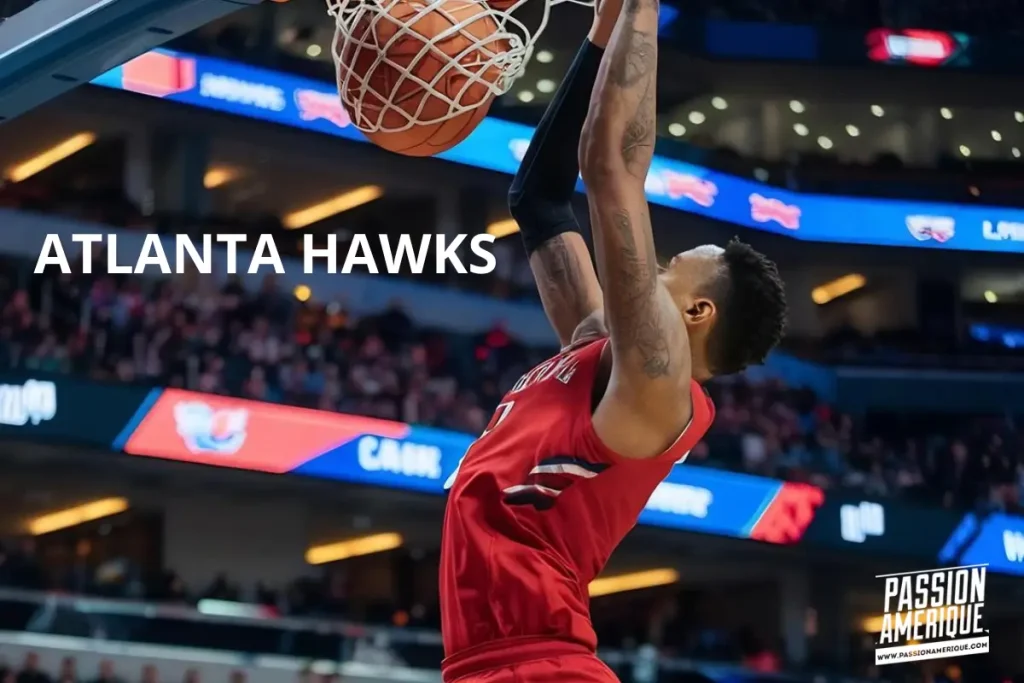 joueurs des atlanta hawks en train de faire un dunk dans le stade lors d'un match a Atlanta